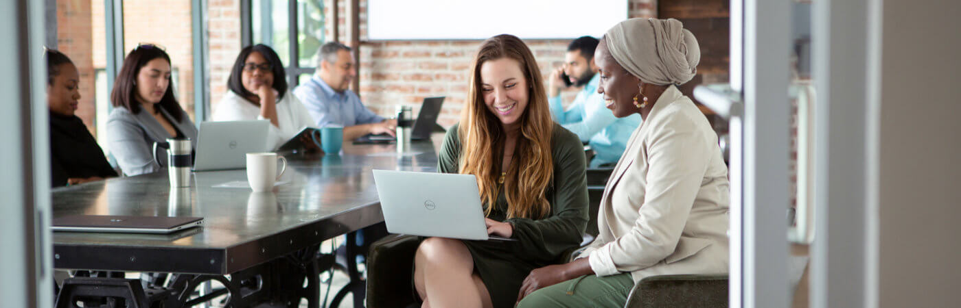 Two women on the Medlytix team looking at computer, data analytics jobs